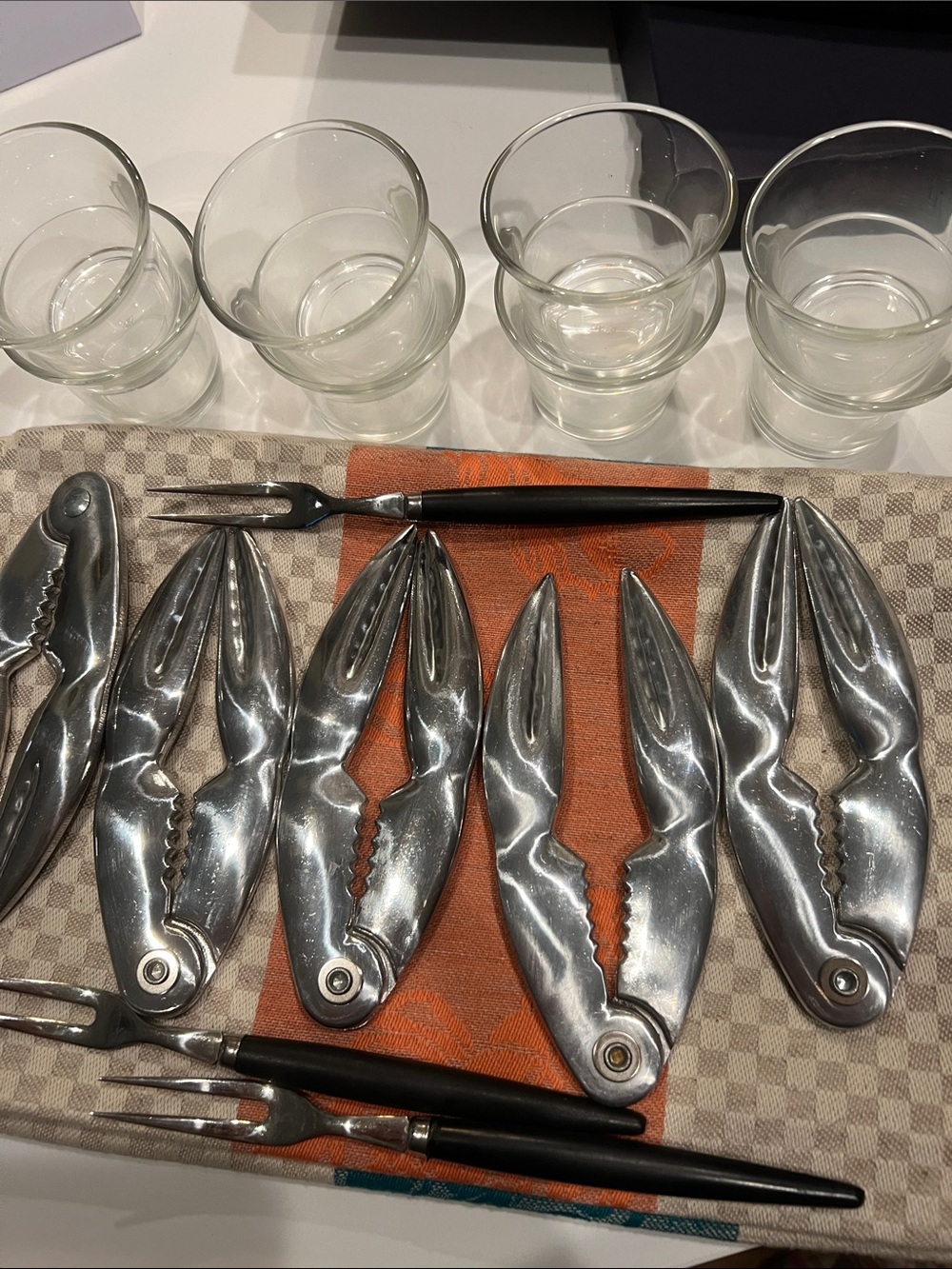 Set of Crab-Shaped Seafood Nutcrackers with butter glass bowls forks and Towels